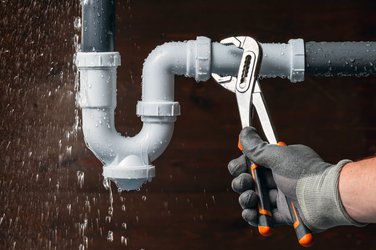 Emergency plumber fixing water leak in sink drain pipe Mississauga